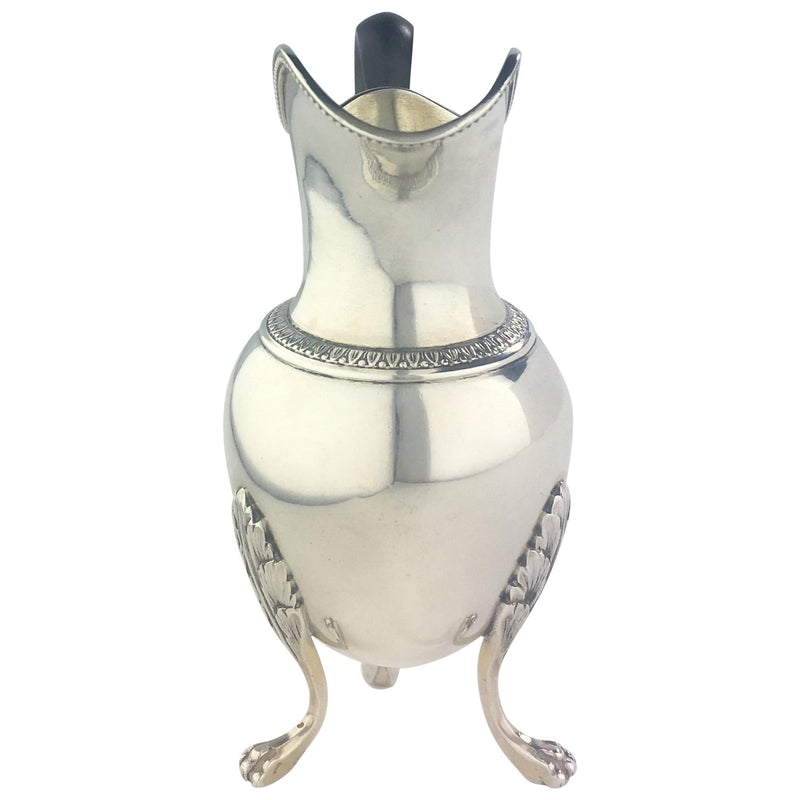 Sterling silver creamer by French silversmith Andre Aucoc, with a beaked spout, turned wooden handle and three clawed feet