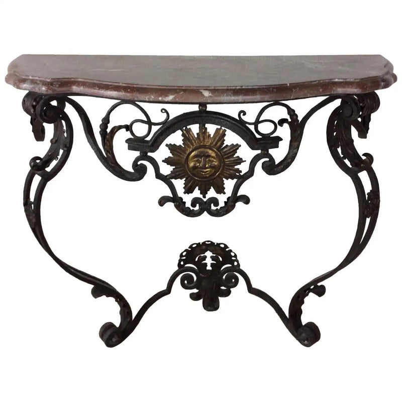 Wrought iron wall console in the Louis XIV manner with carved sun symbol and fleur-de-lis, serpentine marble top