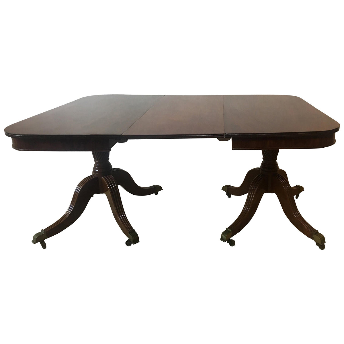 19th century English Regency mahogany double pedestal extending dining table