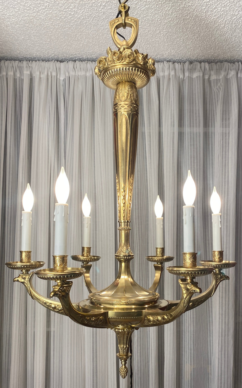 French Art Deco gilt bronze six-arm chandelier with central relief sphere and acorn finial, attributed to Sue et Mare