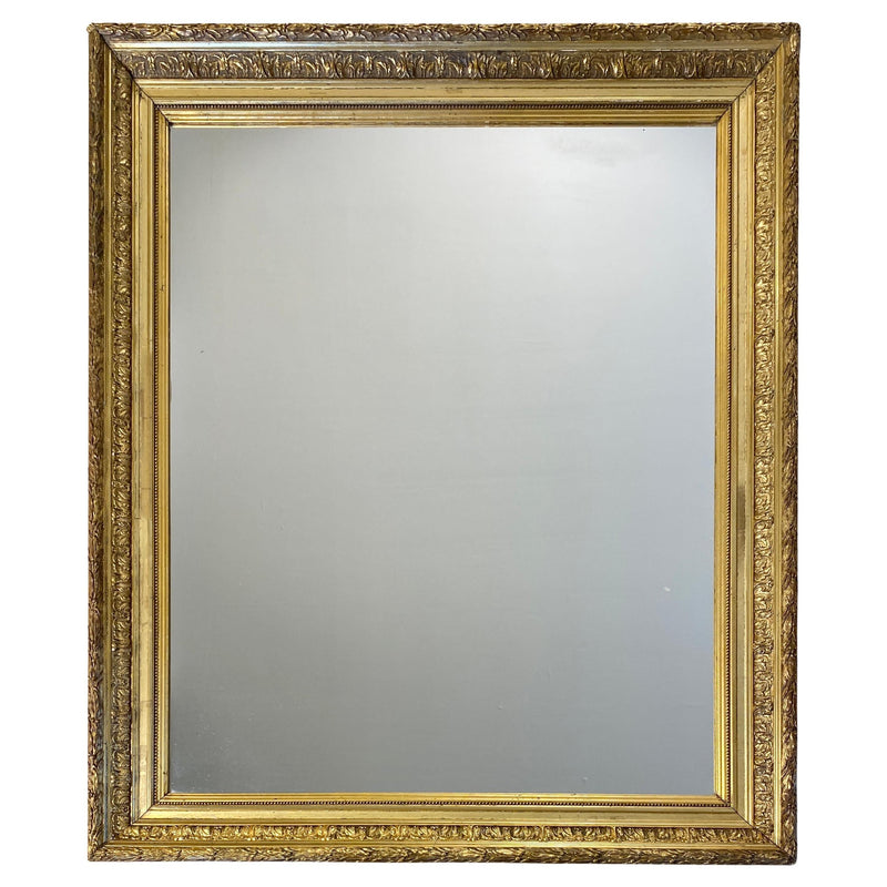 Large Louis XVI style giltwood mirror with carved frame detail
