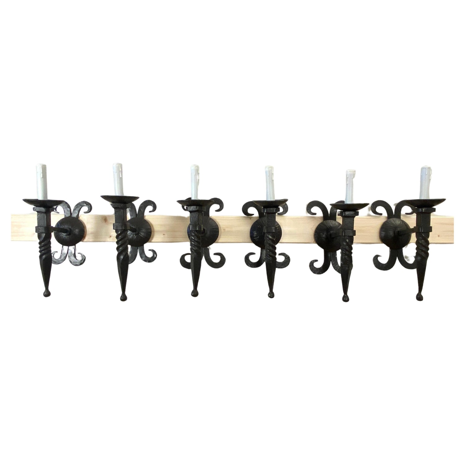 Early 20th century — hand-forged iron wall sconces