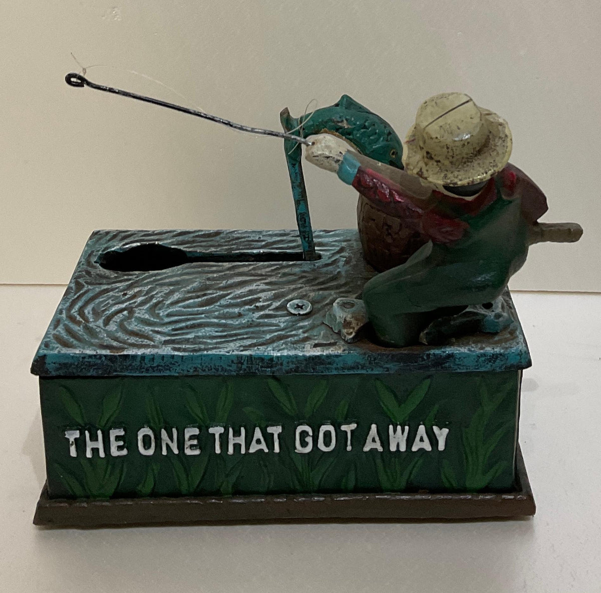 Antique Cast Iron Penny or Money Bank Boy Fishing Marked "The One That Got Away" — detail 3