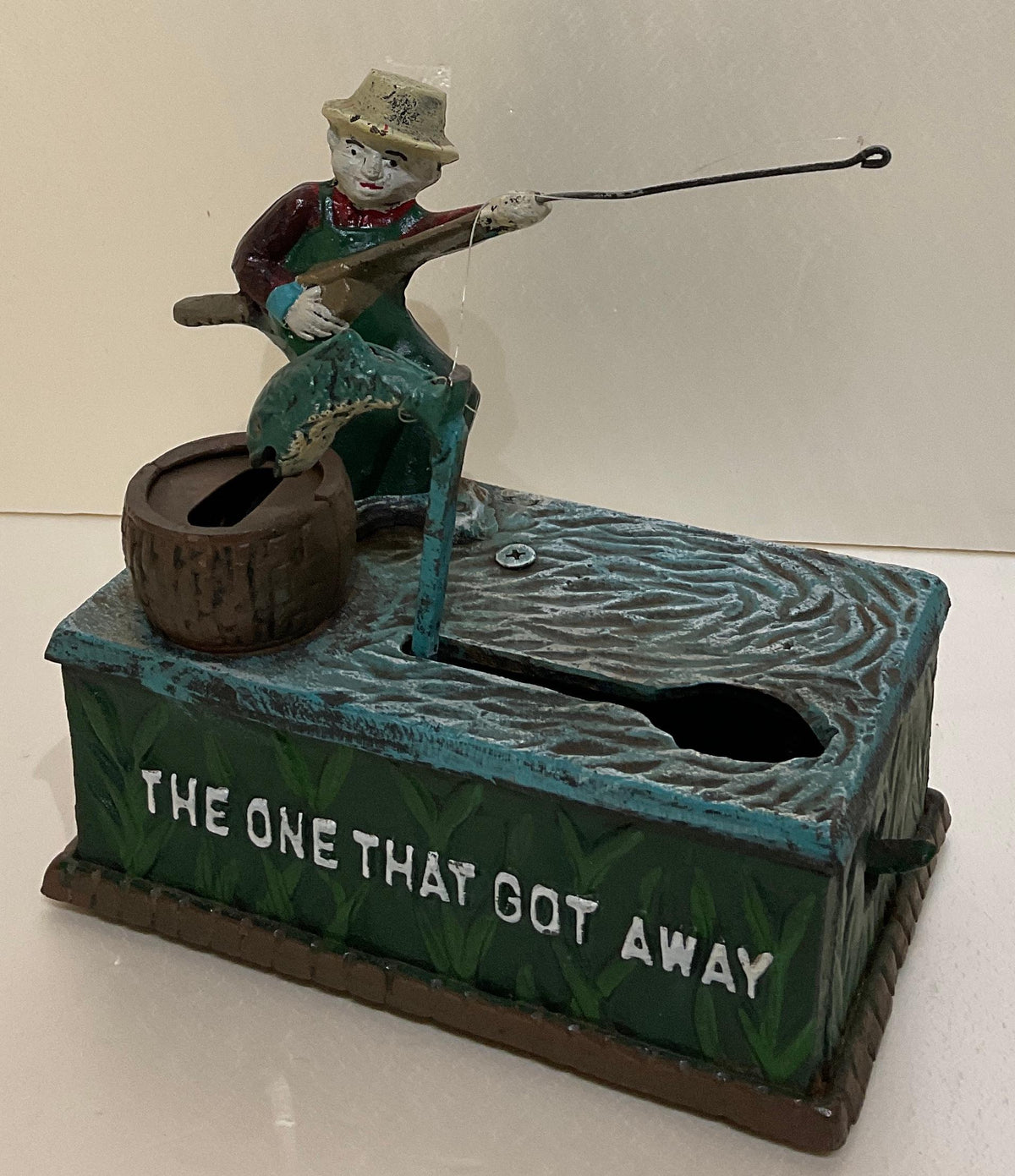 Antique Cast Iron Penny or Money Bank Boy Fishing Marked "The One That Got Away" — detail 4