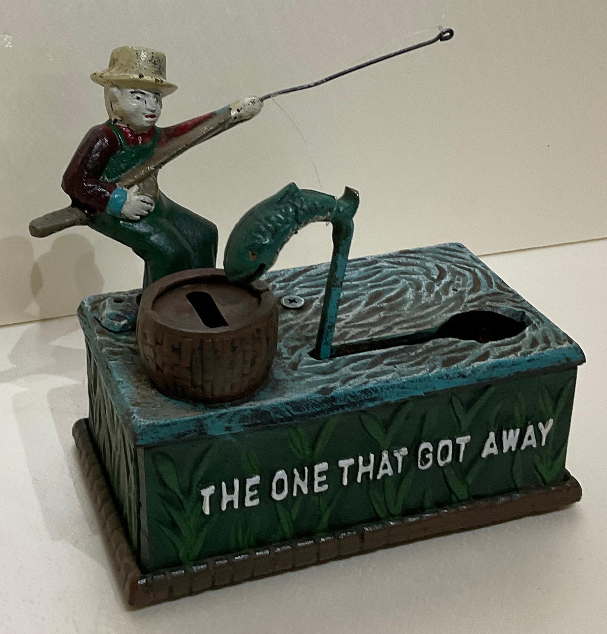 Antique Cast Iron Penny or Money Bank Boy Fishing Marked "The One That Got Away" — detail 2